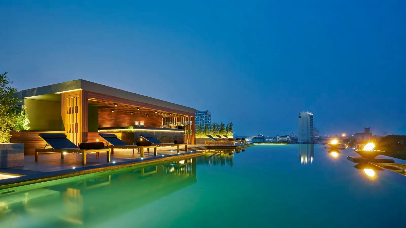 Anantara Chiang Mai Resort &mdash; the pool terrace above the Ping at dusk