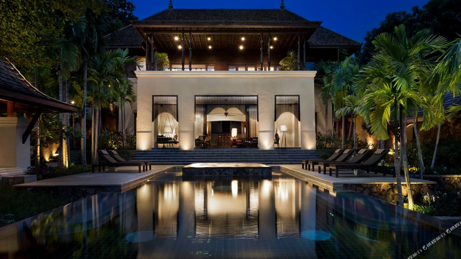 Four Seasons Resort Chiang Mai &mdash; the resort at dusk, mirrored in still water