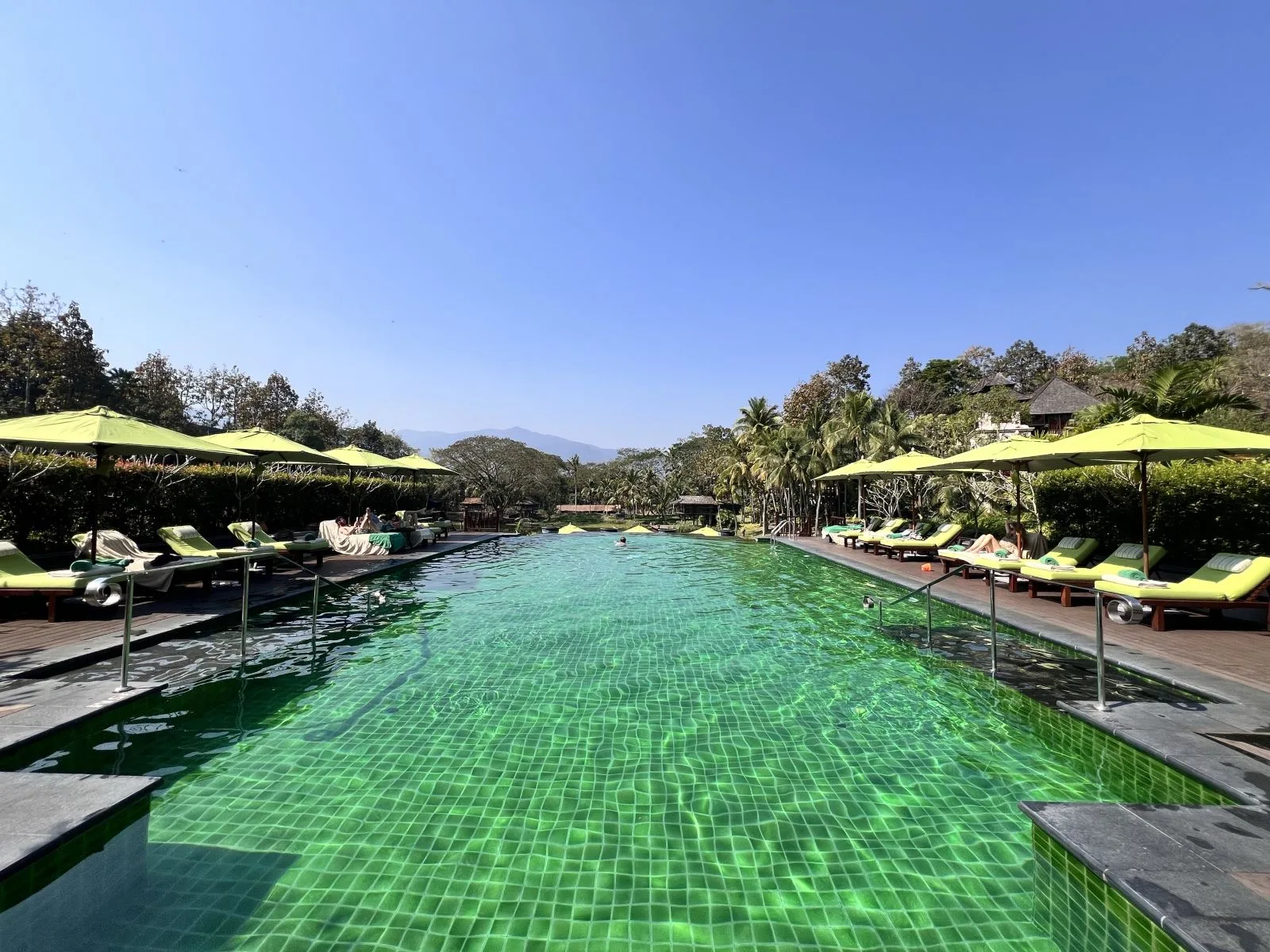 Four Seasons Resort Chiang Mai &mdash; the long terrace pool above the valley