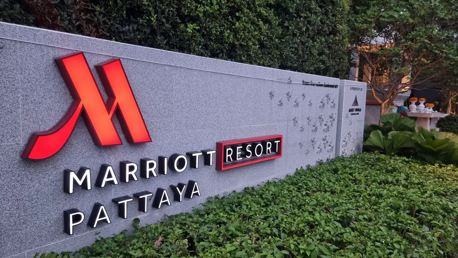 Pattaya Marriott Resort & Spa — the illuminated entrance wall on Jomtien Beach Road at dusk, Pattaya