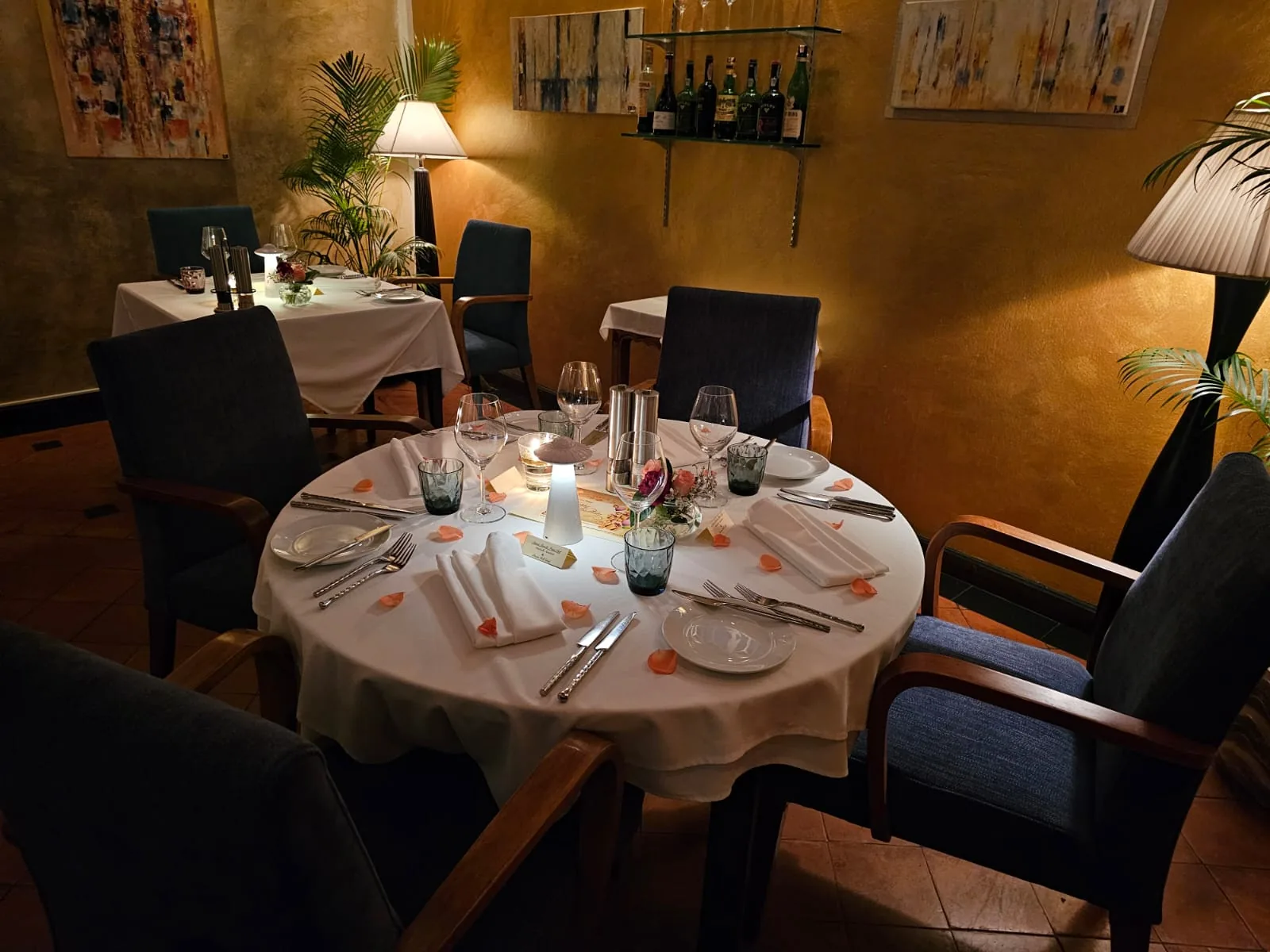 Cafe des Amis — a candlelit table setting in the dining room