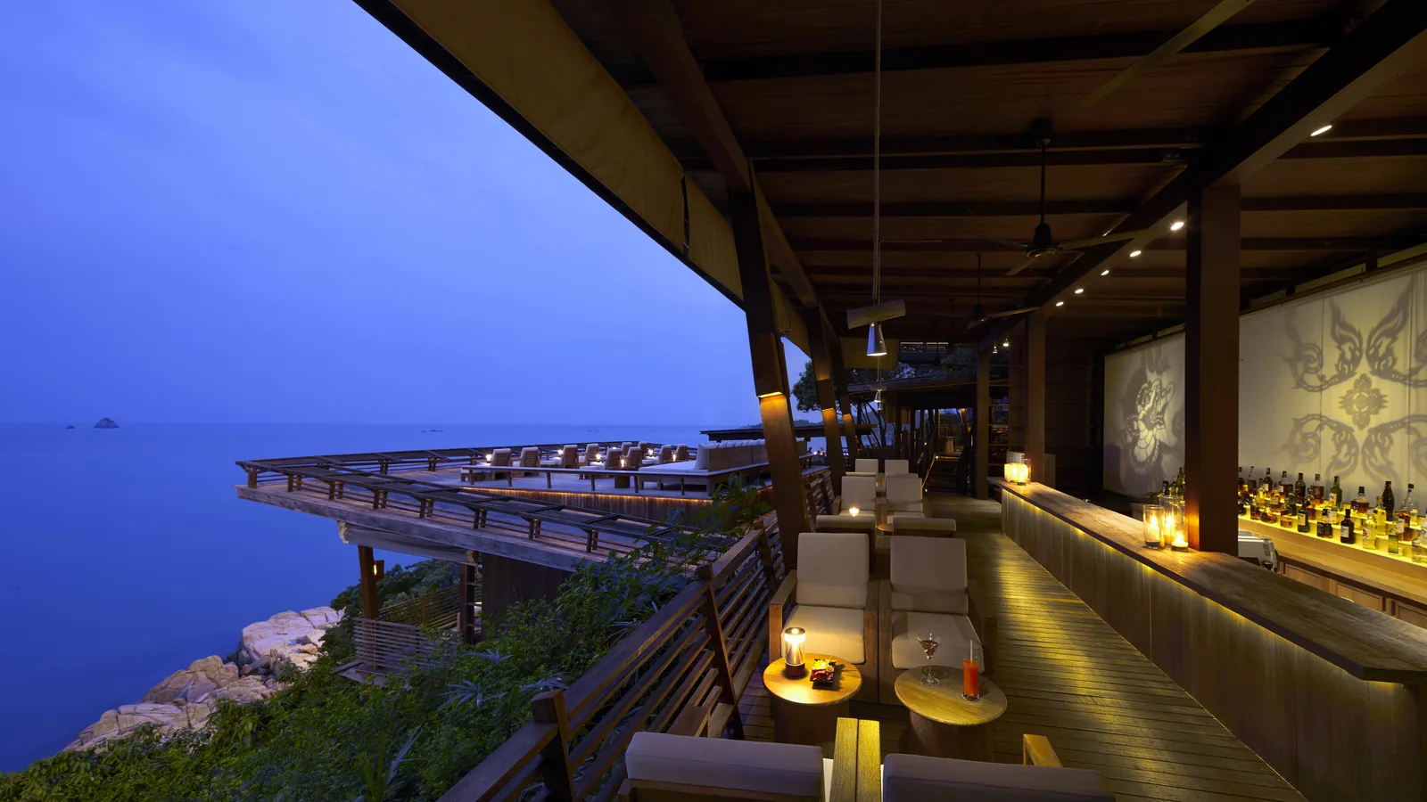 The bar deck at Dining on the Rocks, Six Senses Samui, at dusk